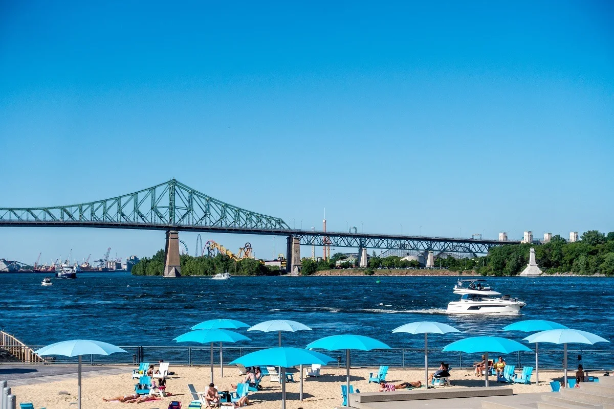 Umbrellas on sandy by the river 