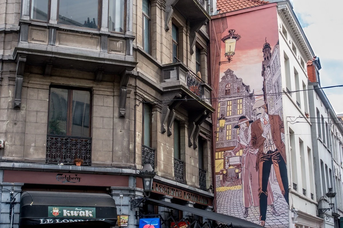 Street art mural showing couple in the streets of Brussels