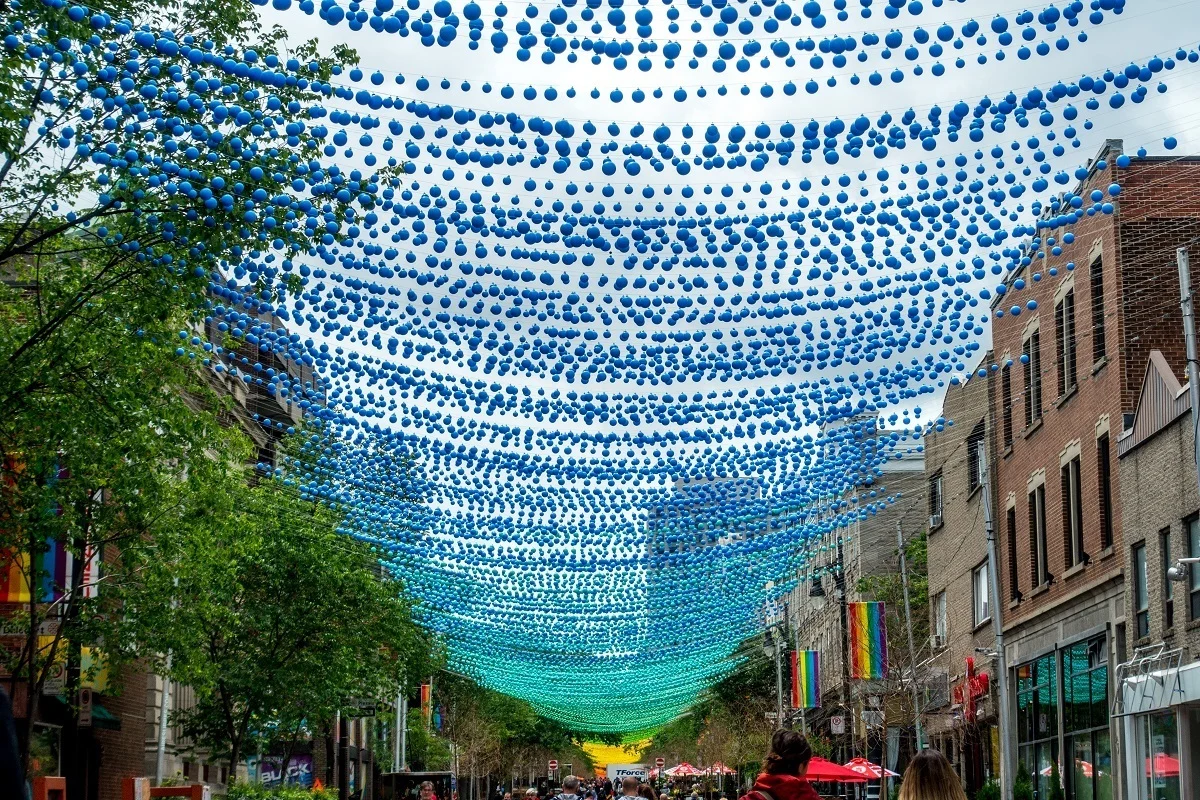 Rainbow decorations strung across street in the Gay Village