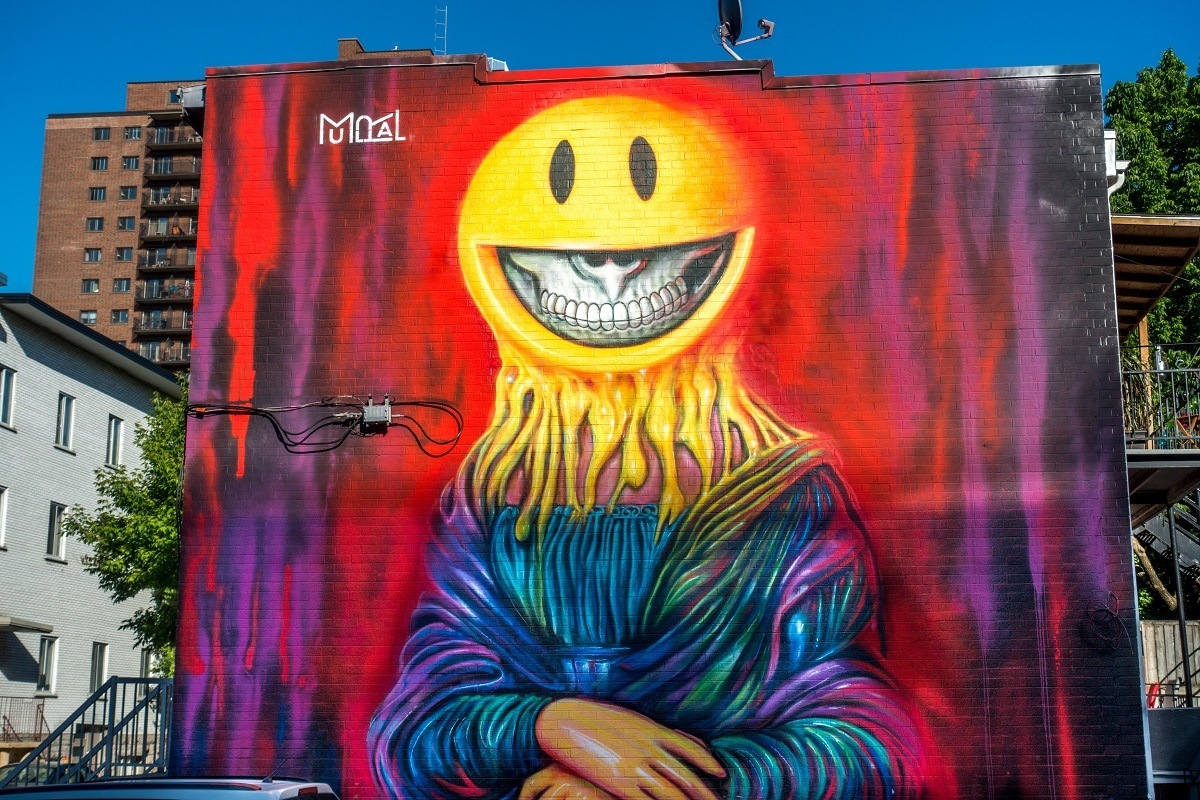 Street art mural modeled after the Mona Lisa with goulish smile