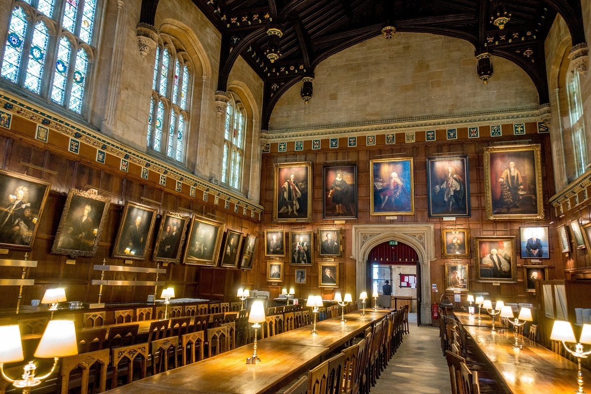 Dining hall with walls lined with portraits