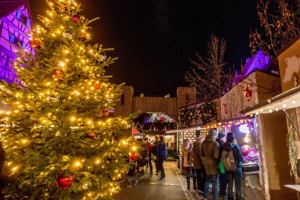 Christmas market stalls and festive decorations.