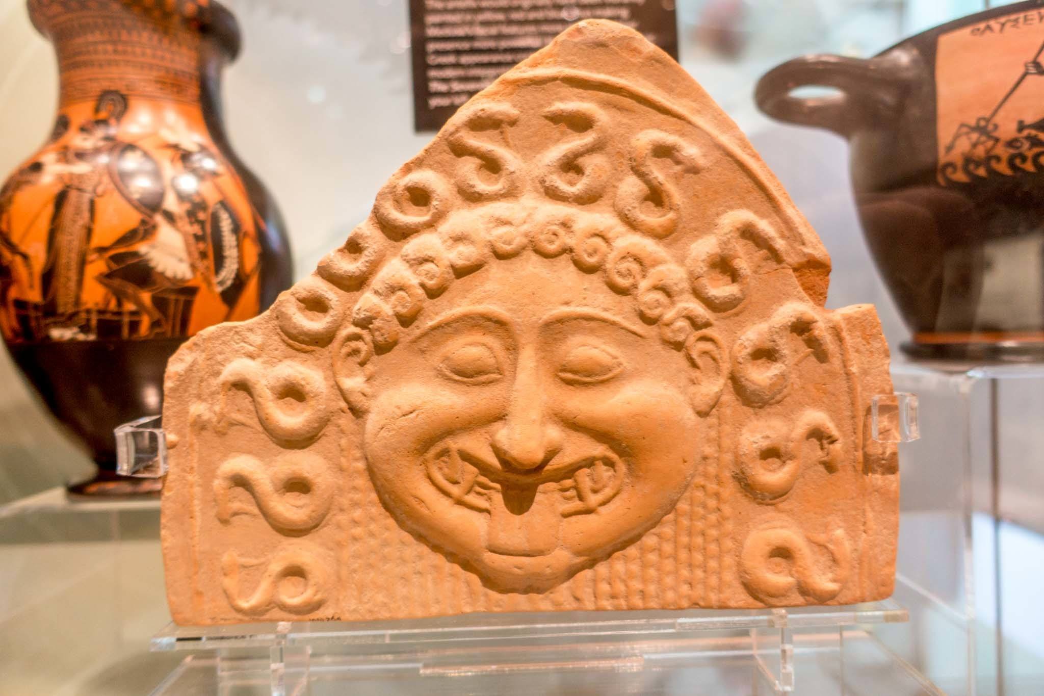 Greek pottery artifact displayed in a museum