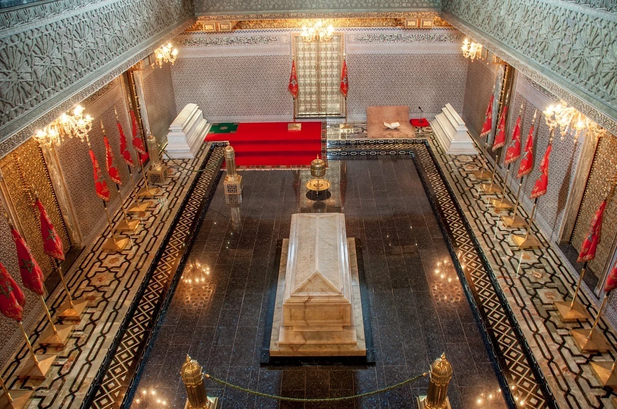 Overhead view of a marble tomb in a great room.
