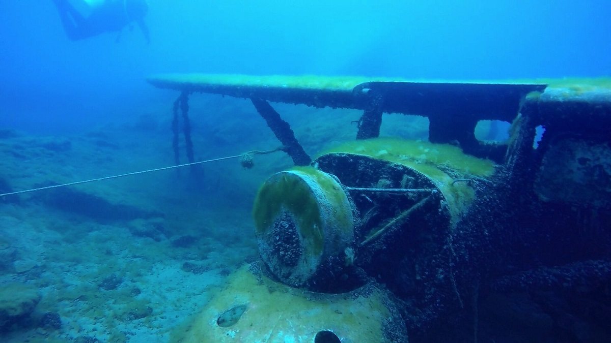 Scuba diver with submerged airplane at Dutch Springs near Bethlehem