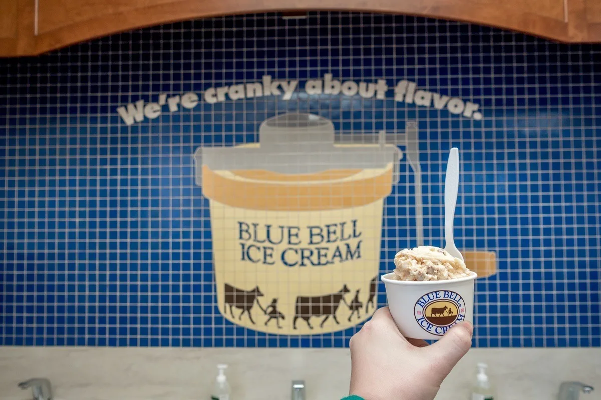 Ice cream cup in front of mosaic at Blue Bell ice cream factory 