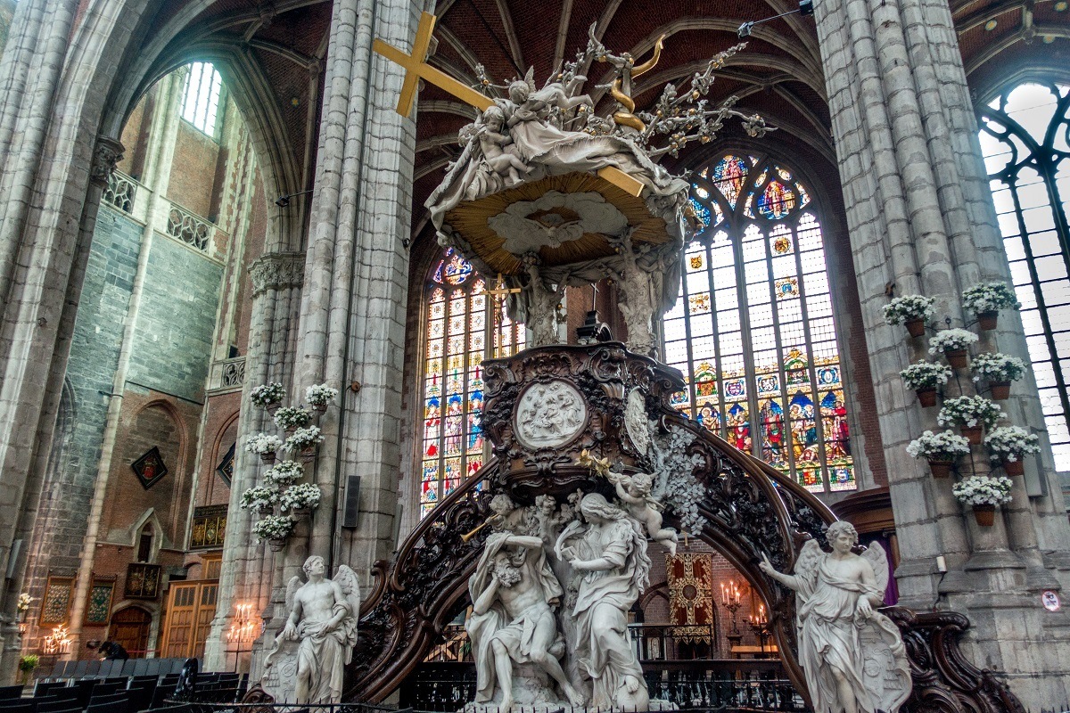 Elevated ornate pulpit covered in sculptures