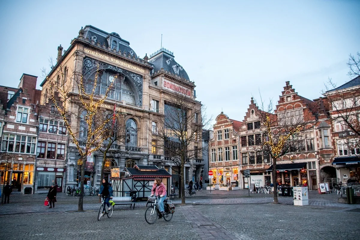 People on bicycles in Ghent city square, Vrijdagmarkt
