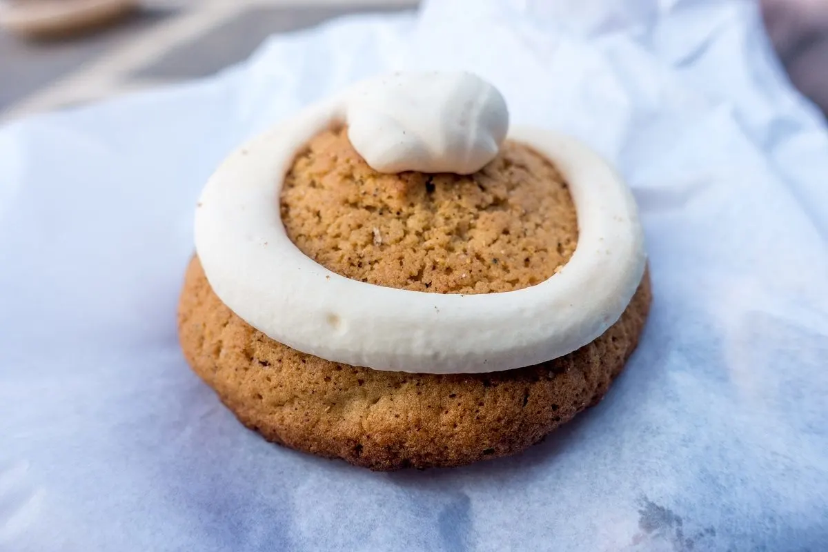 Gingerbread-like biscuit topped with swirls of icing.