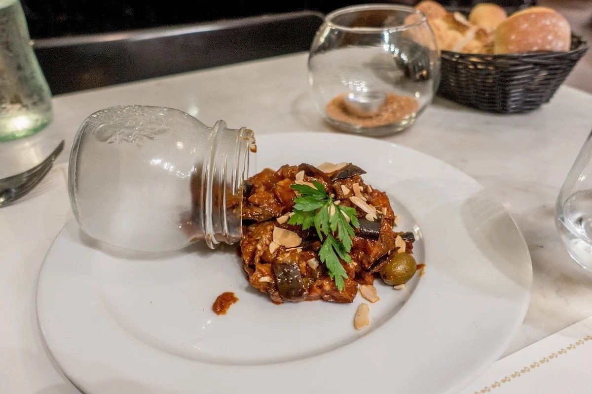 Dip made from tomatoes and eggplant on a plate.