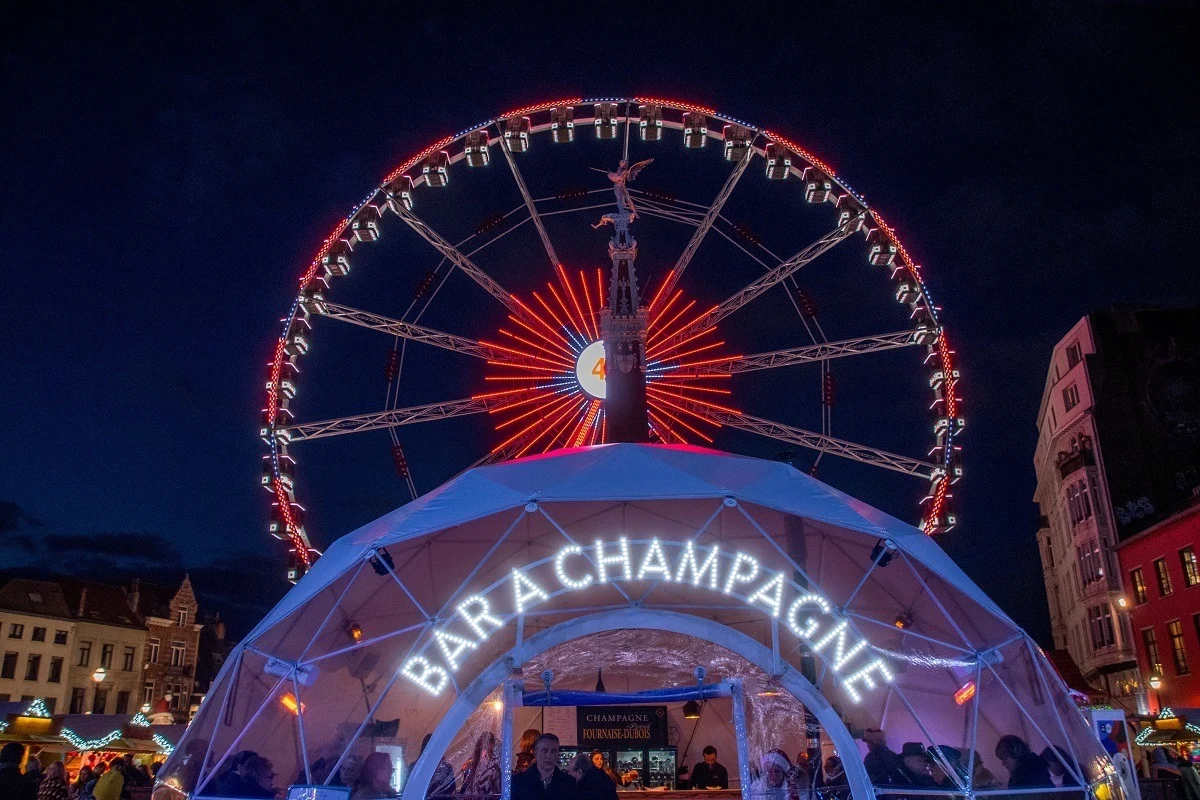 Ferris wheel behind champagne bar tent