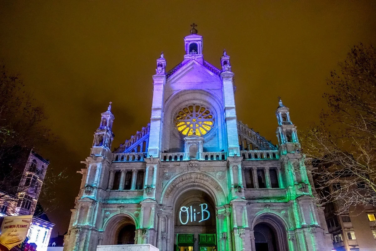 Church lit up in multiple colors for light show. 