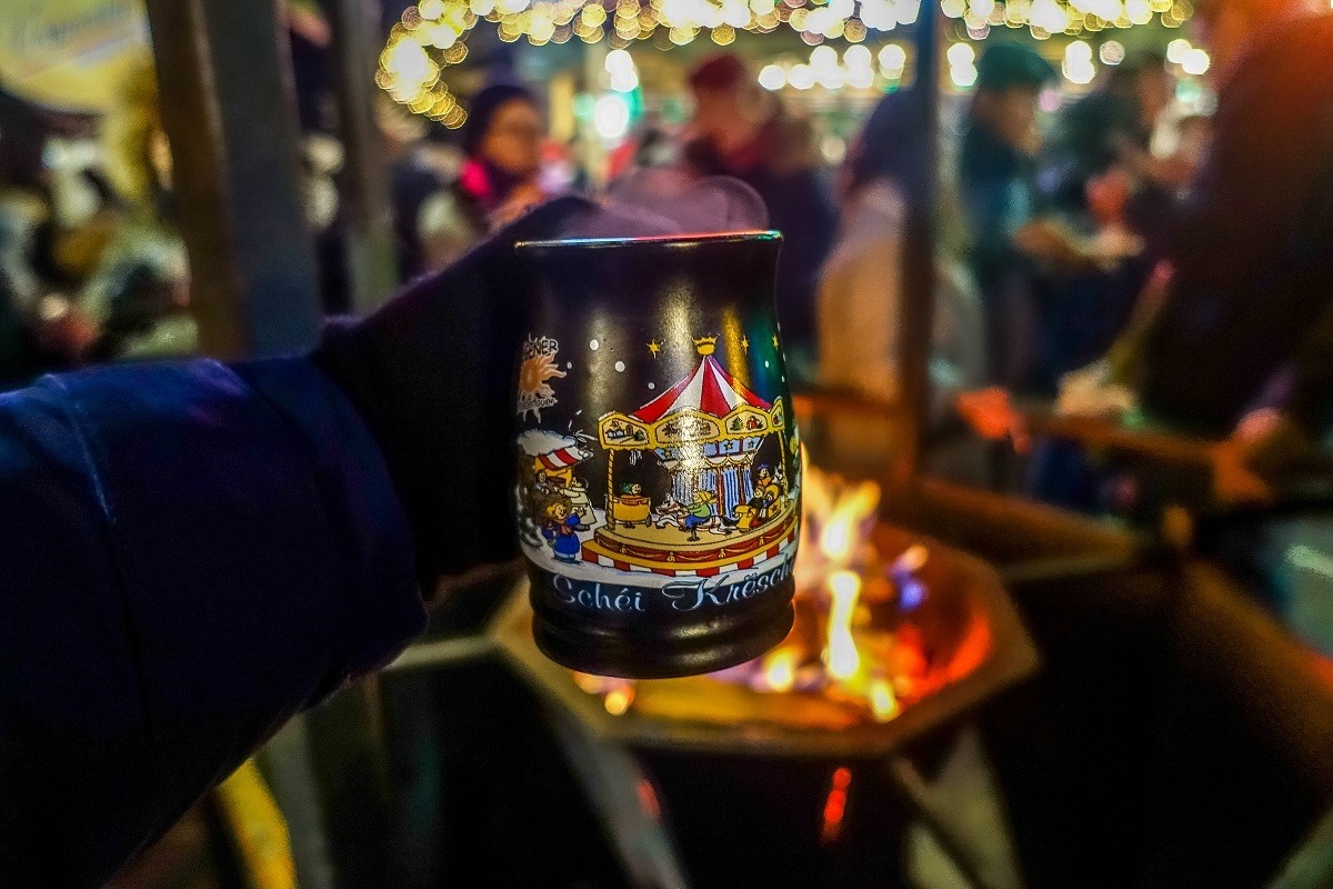 Mulled wine in a mug over an open fire