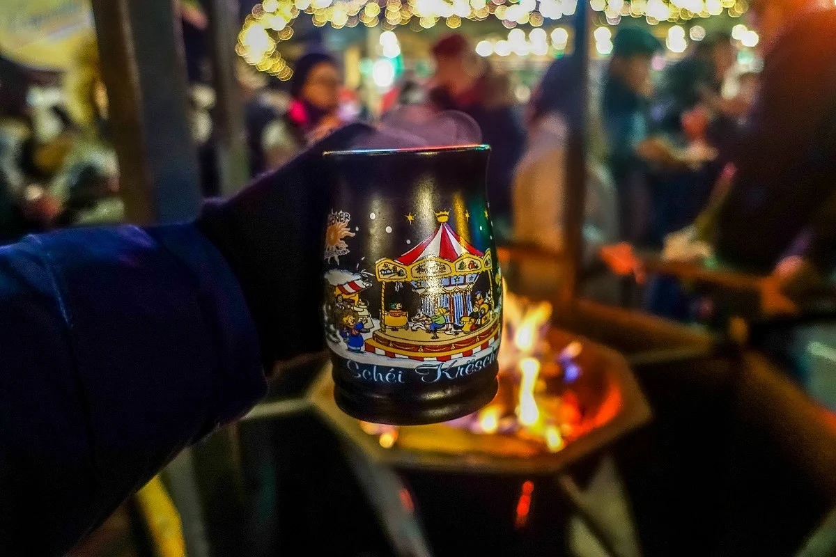Mulled wine in a mug over an open fire