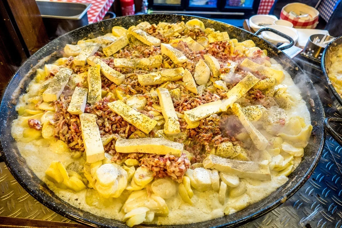 Pan of tartiflette, a mix of potatoes, onions, lardons, cheese, and wine