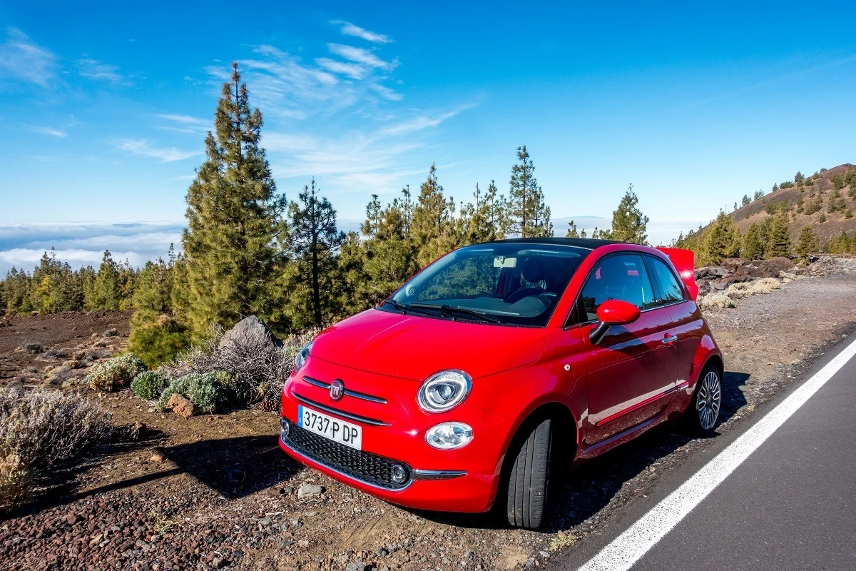 Red rental car on the side of the mountain road on Tenerife