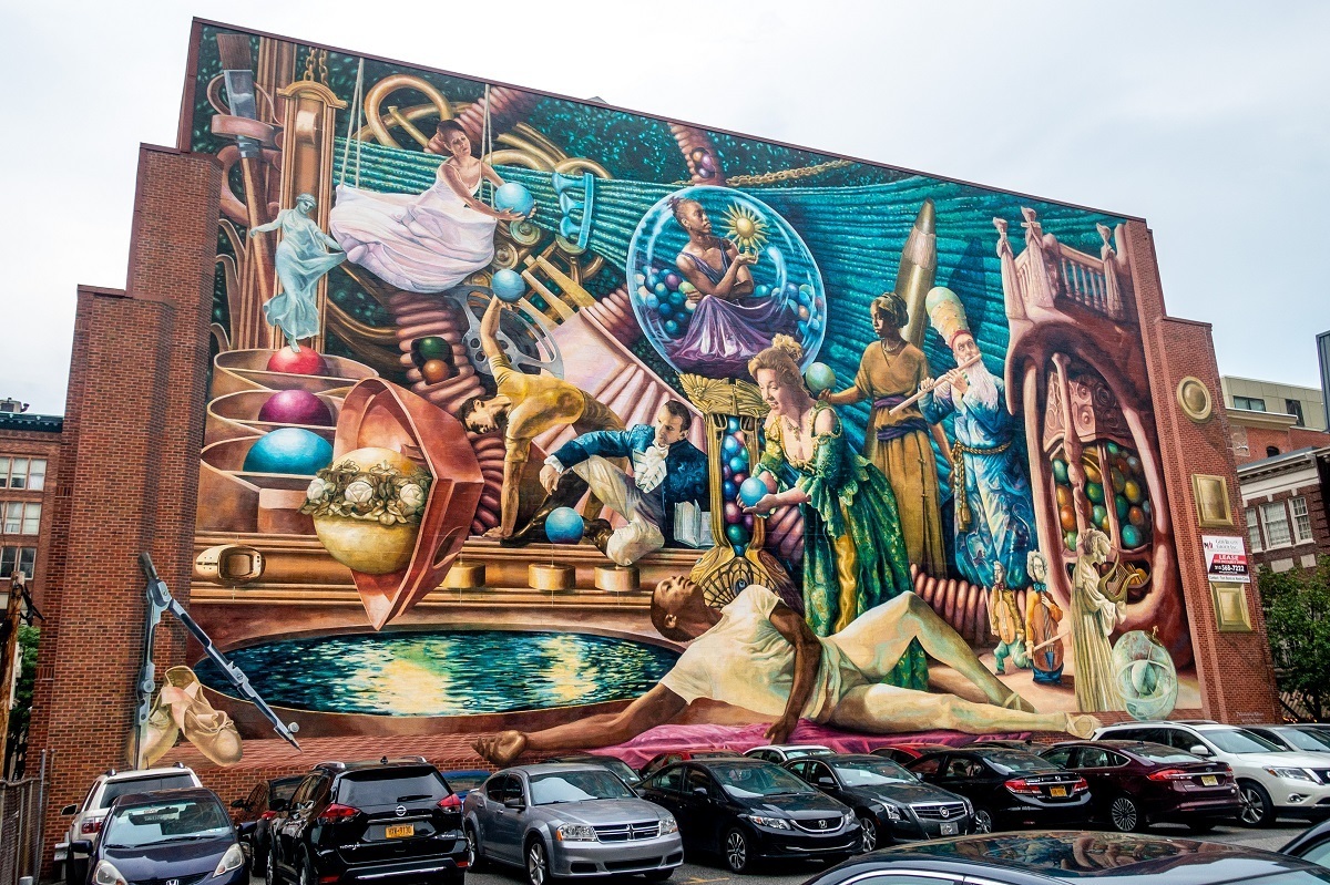 Street art mural depicting the classical muses