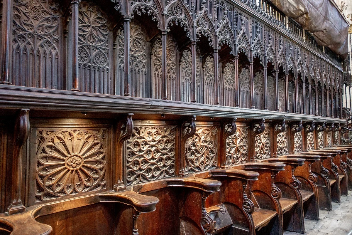 Ornately-carved wooden choir seating