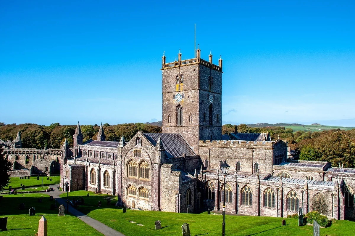 A large stone cathedral with arches and a bell tower