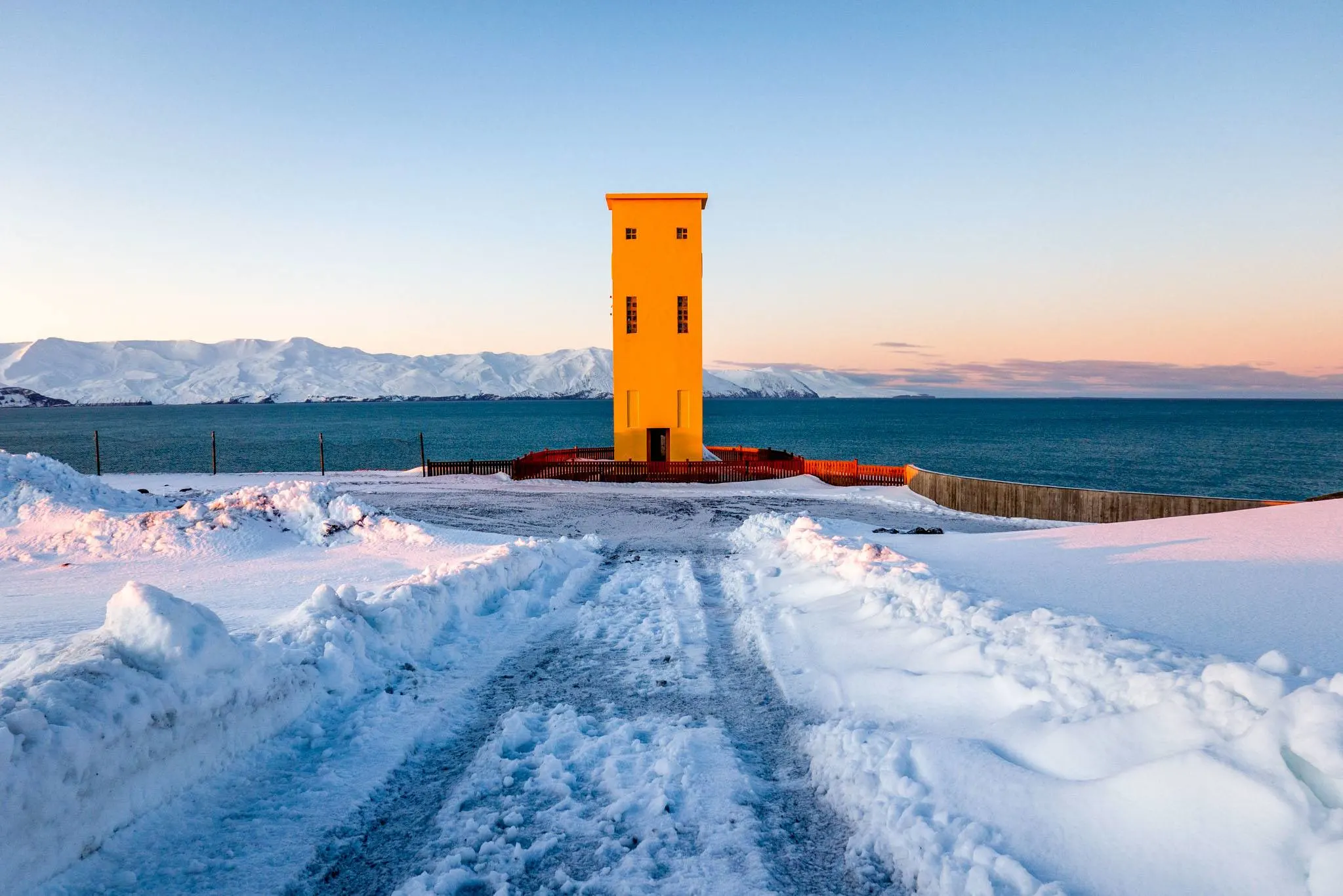 Yellow lighthouse in the snow 