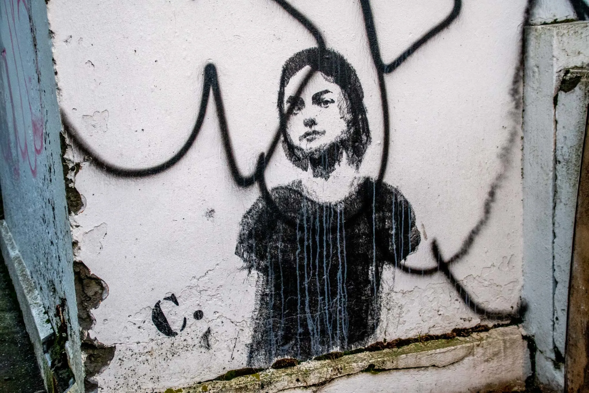 Street art stencil works like this young girl are seen in the Icelandic capital
