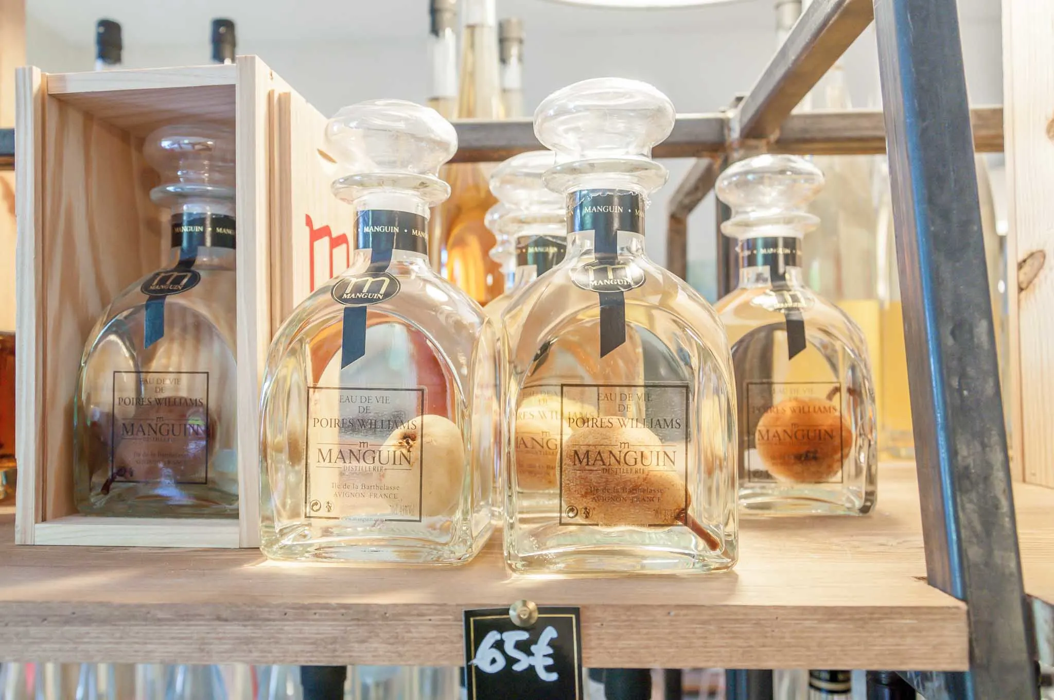 Bottles of pear brandy with a pear inside them.