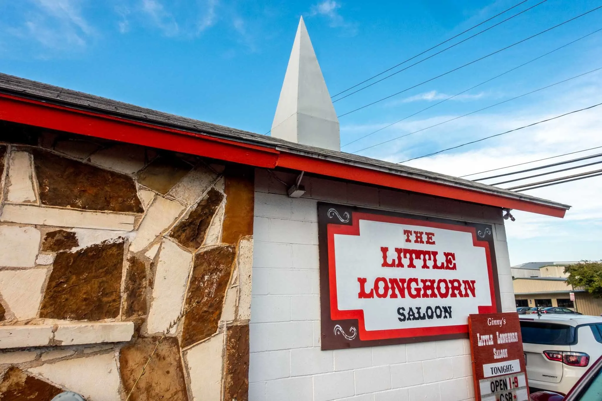 Small white building with a steeple, The Little Longhorn Saloon