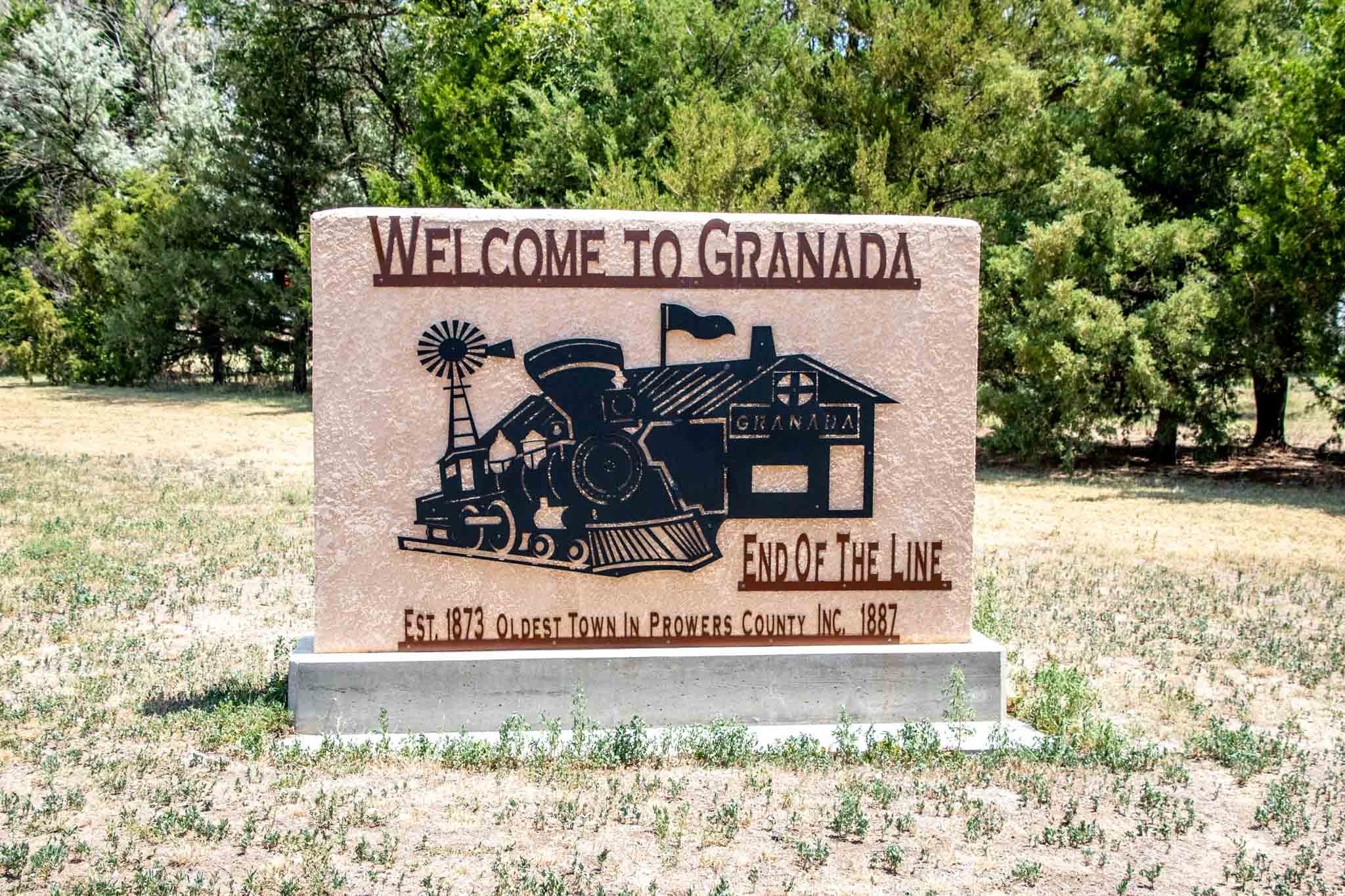 Sign saying Welcome to Granada, End of the Line, Established 1873, oldest town in Prowers County