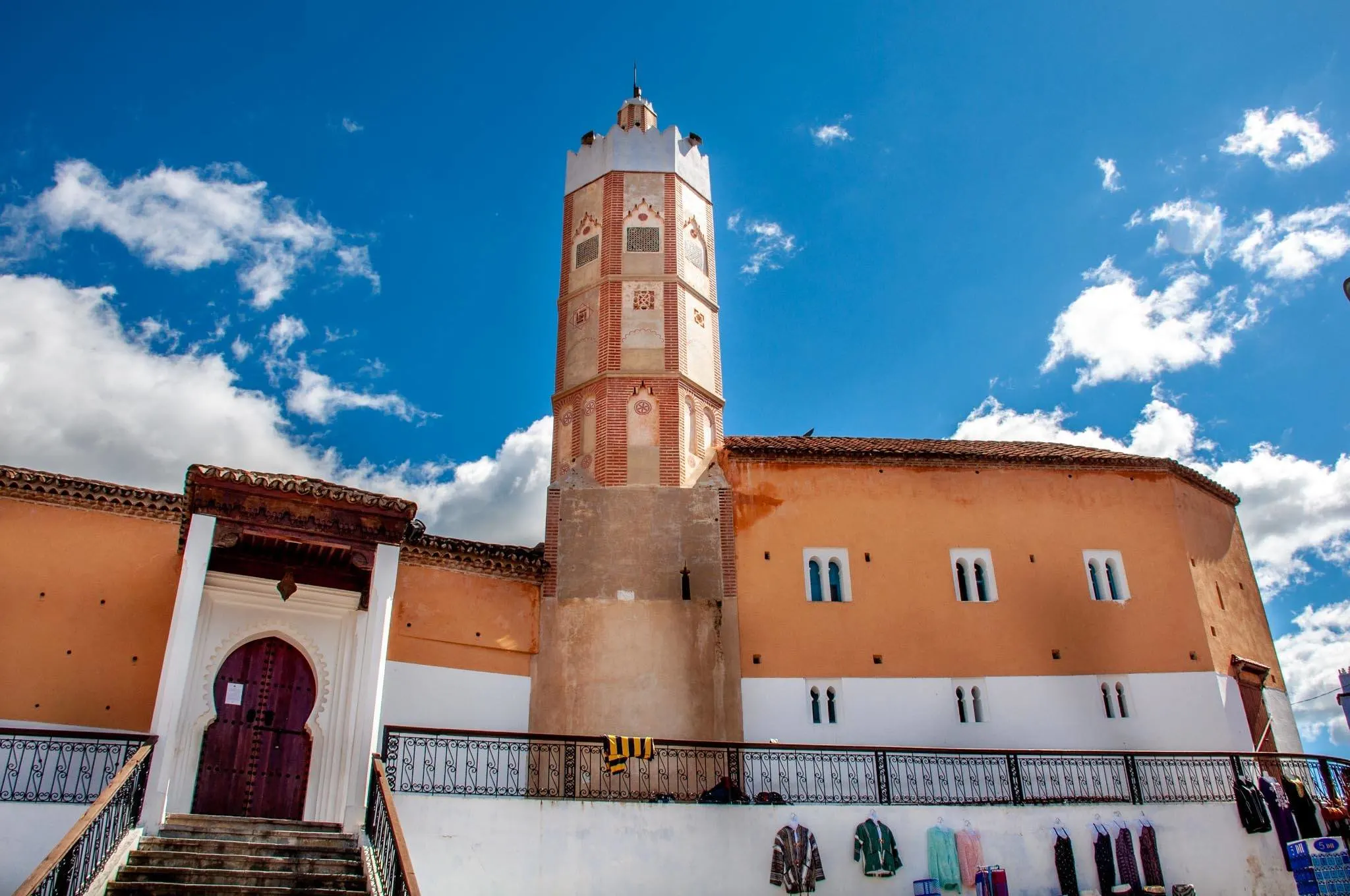 Orange building with a minaret, the Grand Mosque in Chefchaouen