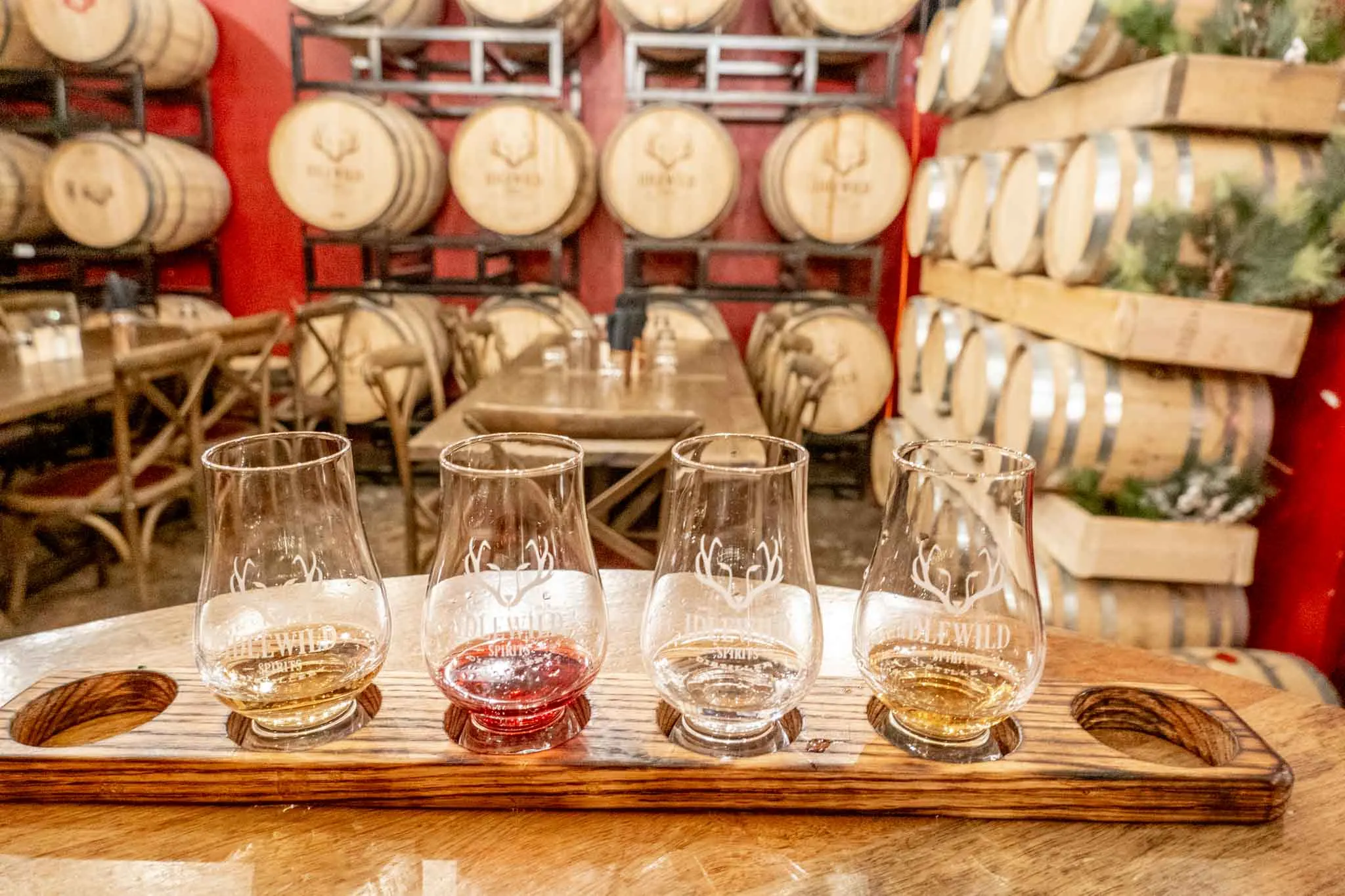 Tasting flight in a room filled with barrels