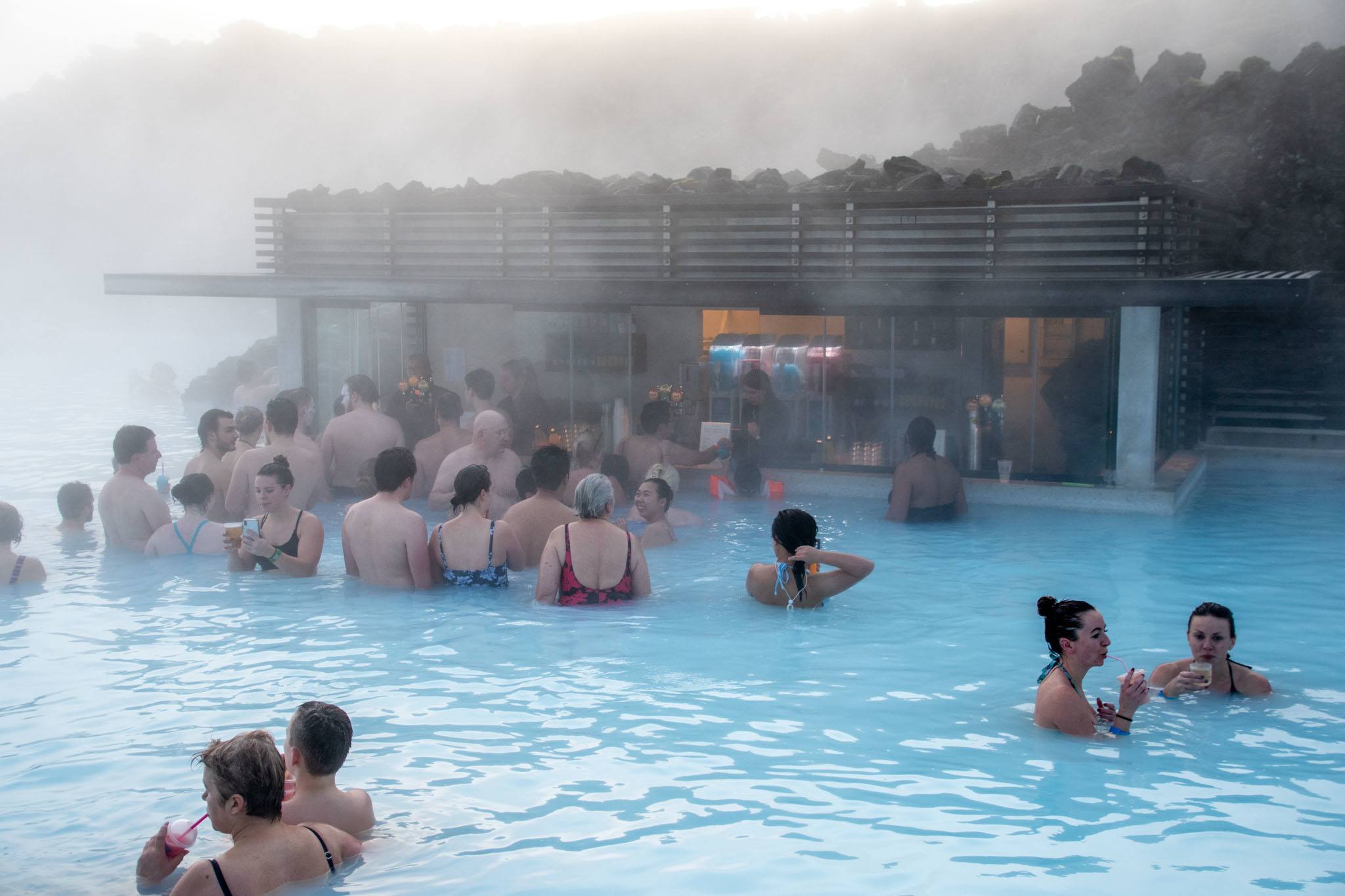 Crowd of people at a swim-up bar