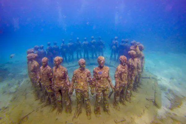 Statues in a circle underwater