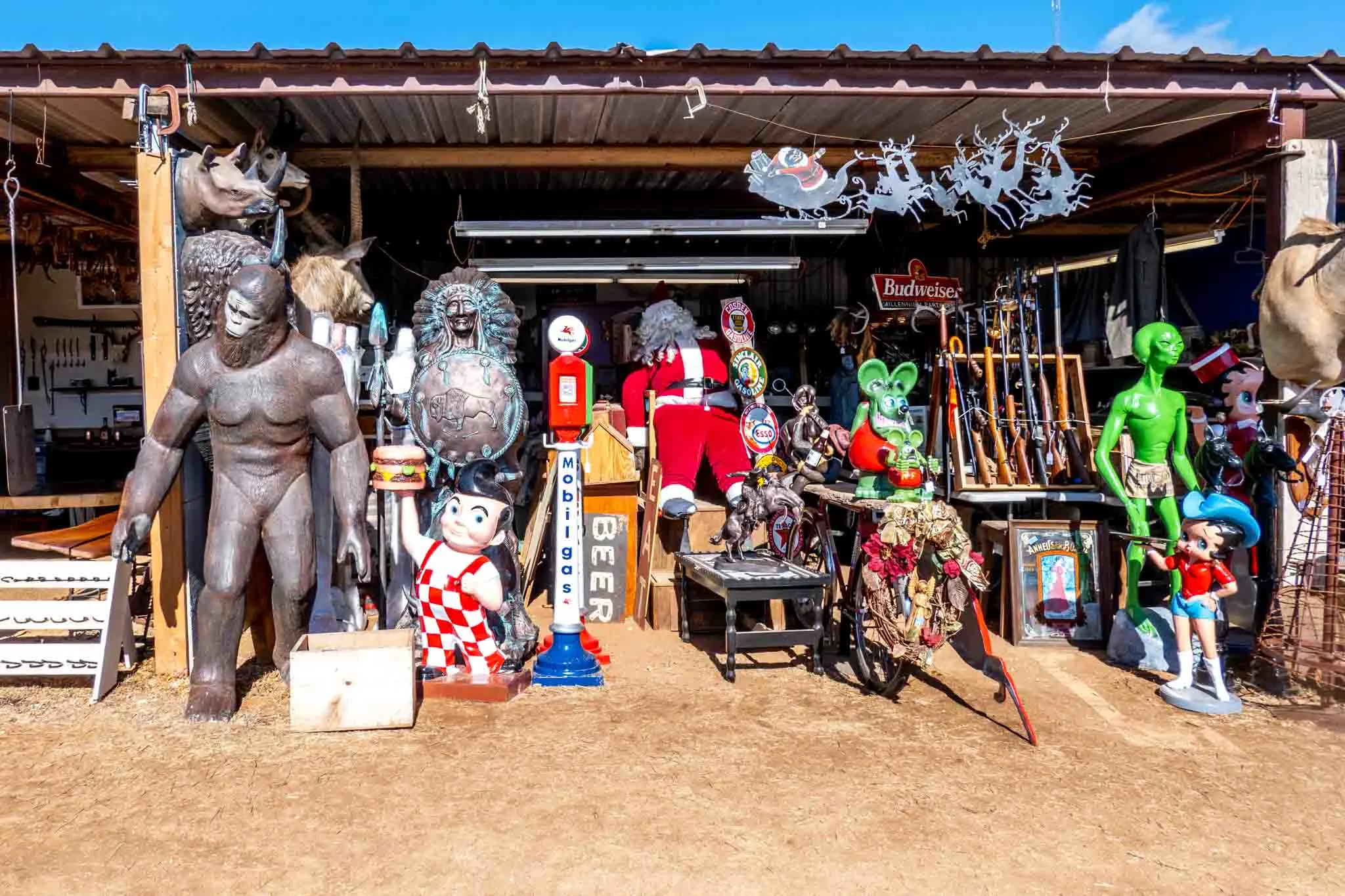 Cartoon characters and mannequins for sale at a flea market. 