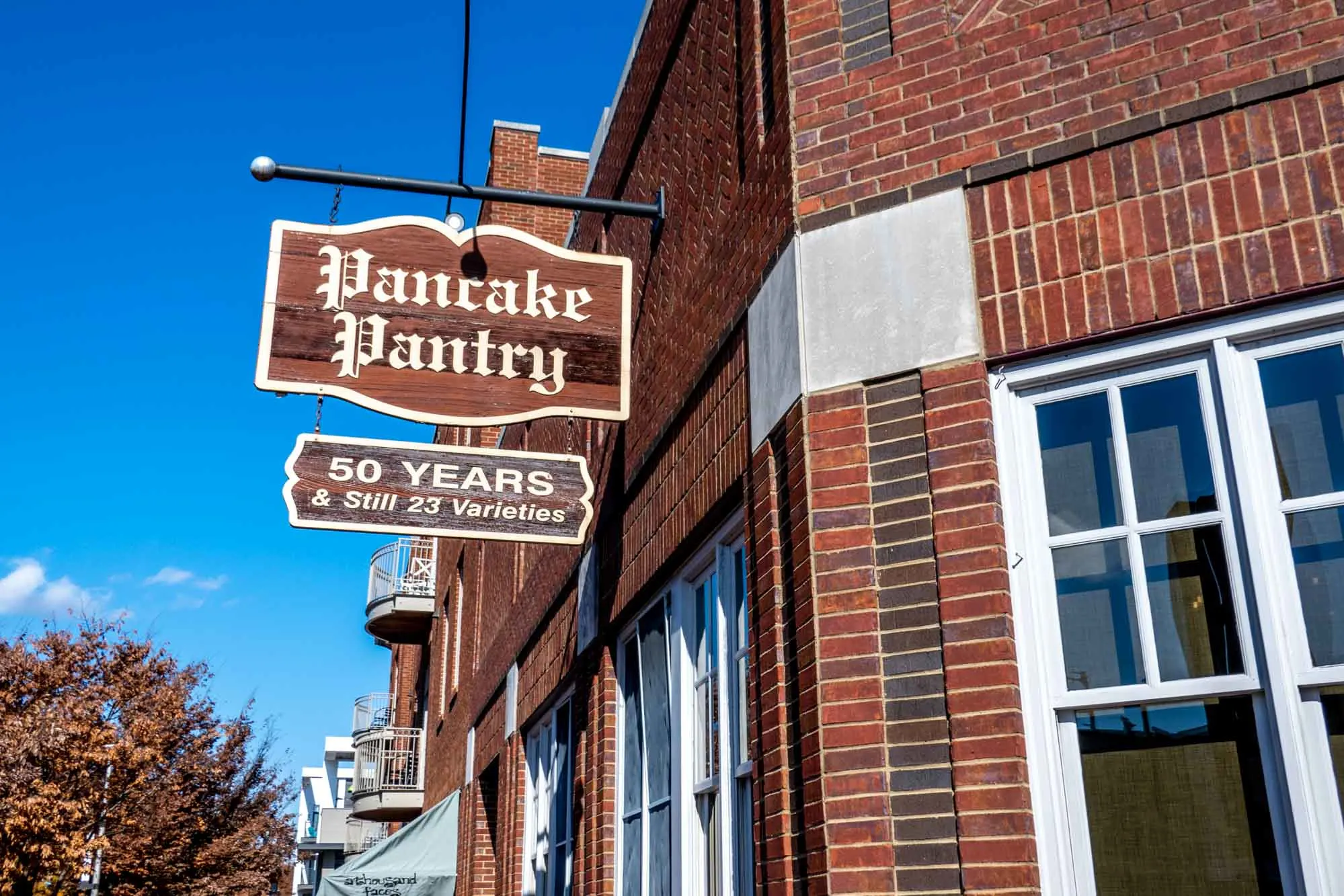 Sign outside a brick building: Pancake Pantry, 50 Years & Still 23 Varieties