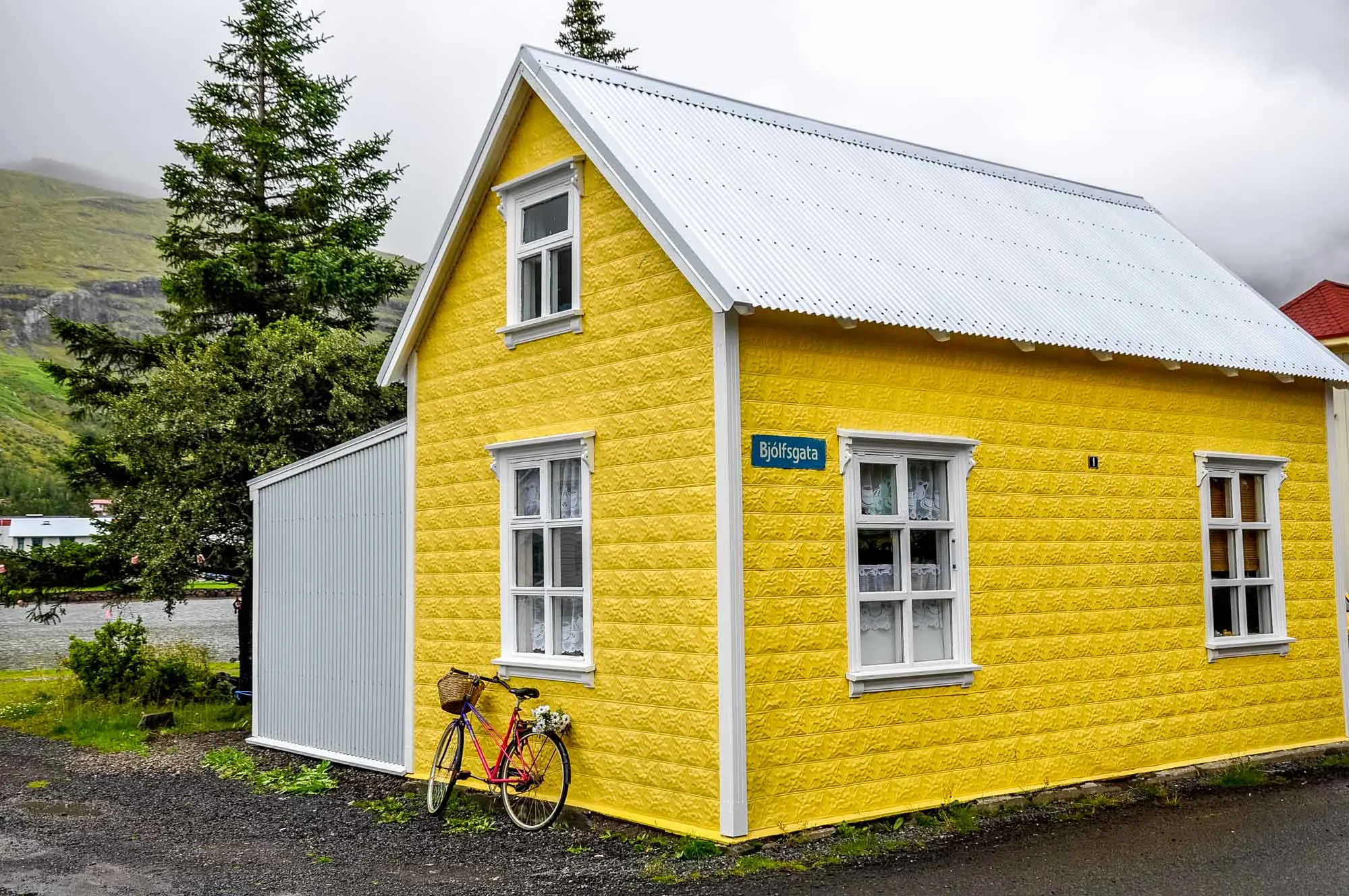 Beautiful yellow house with bicycle