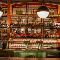 Bar lined with spirits and bar glasses