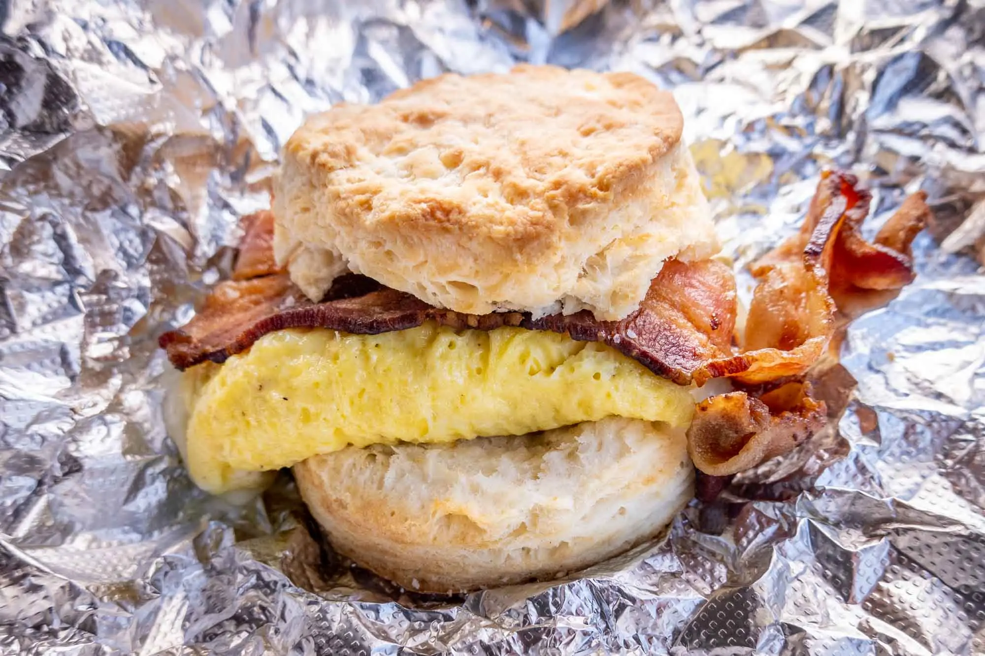 Bacon and egg on a buttermilk biscuit sandwich