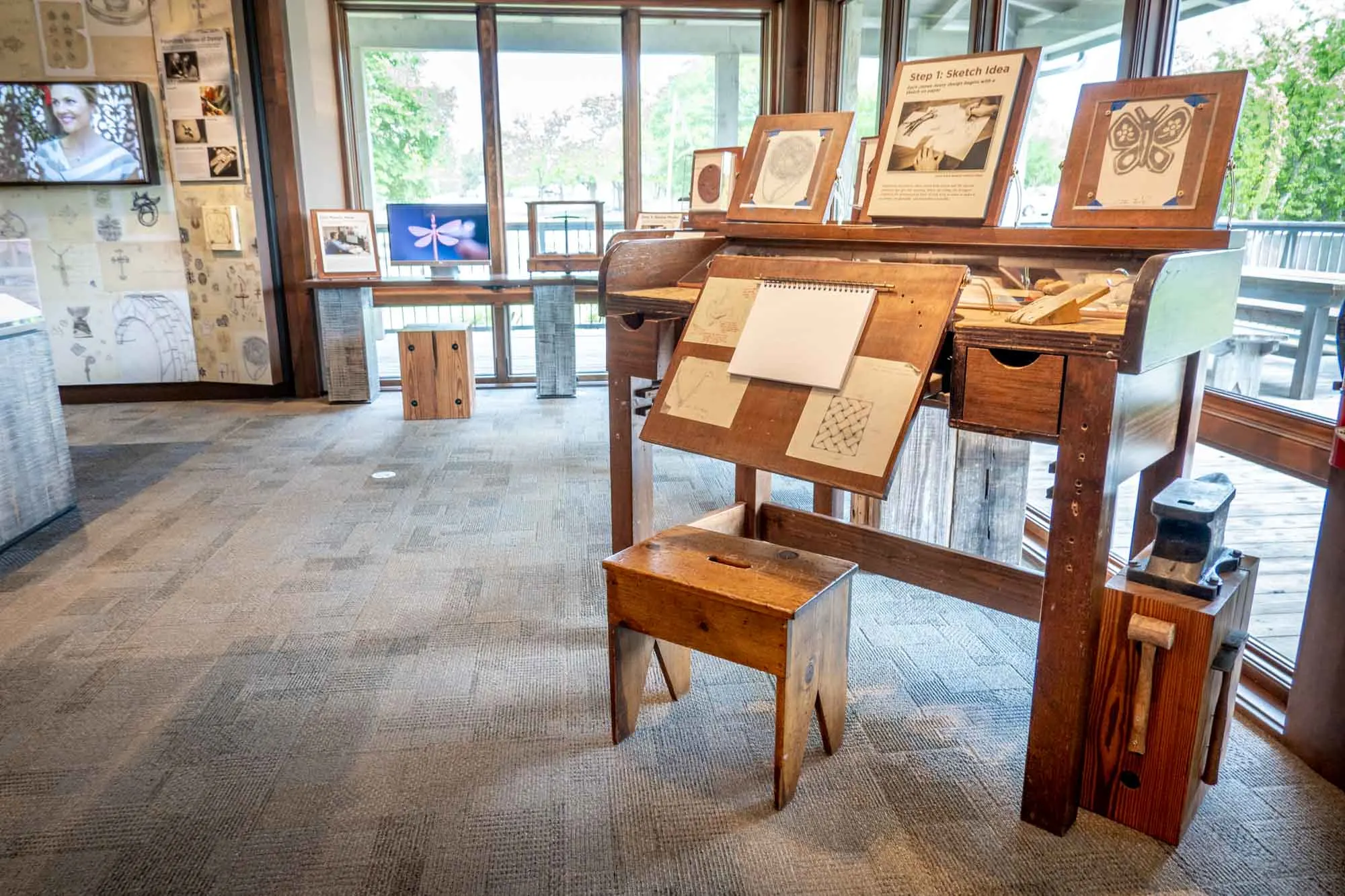 Drawings of jewelry designs in a museum.