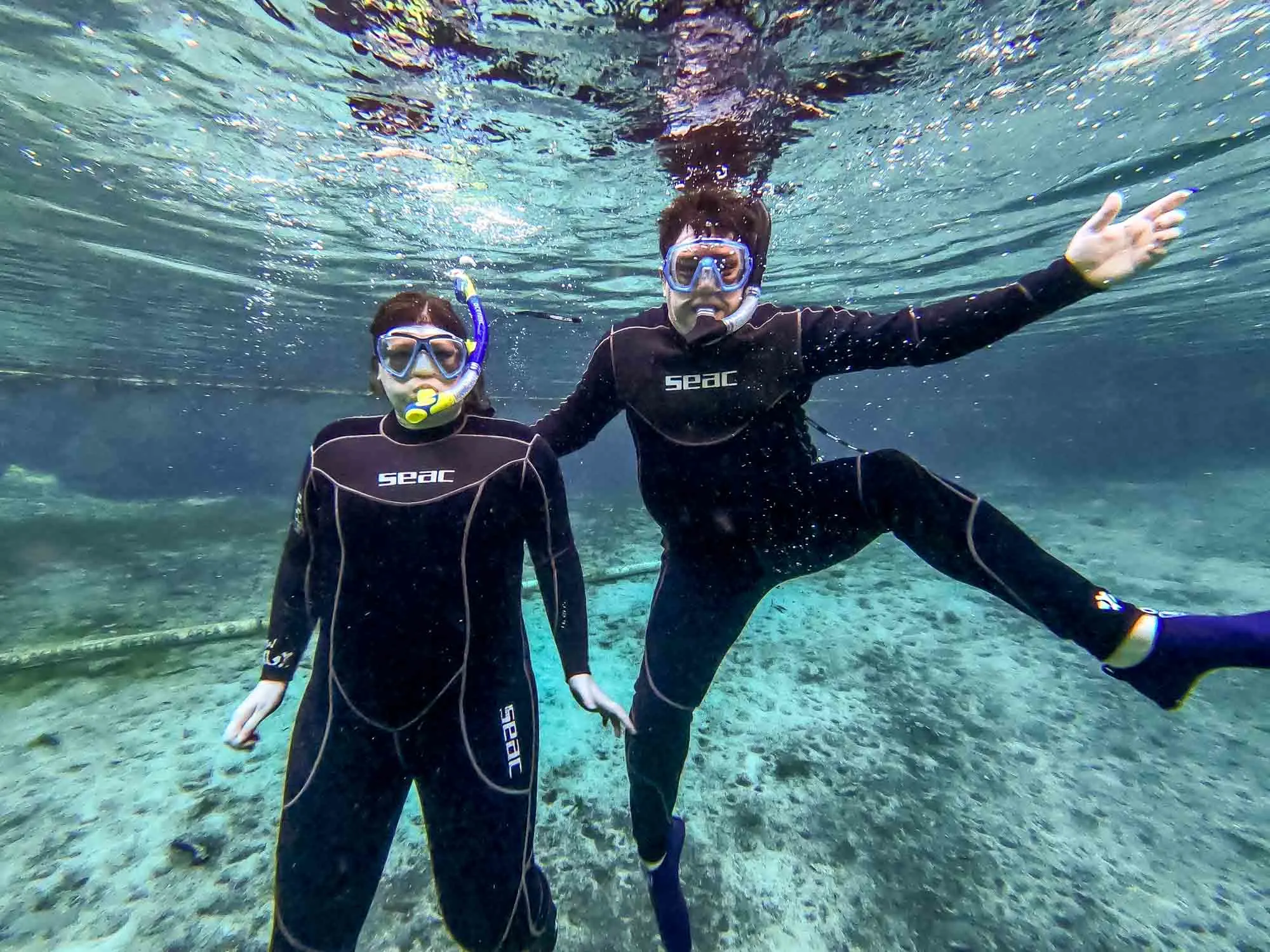 Lance and Laura posing for a photo underwater