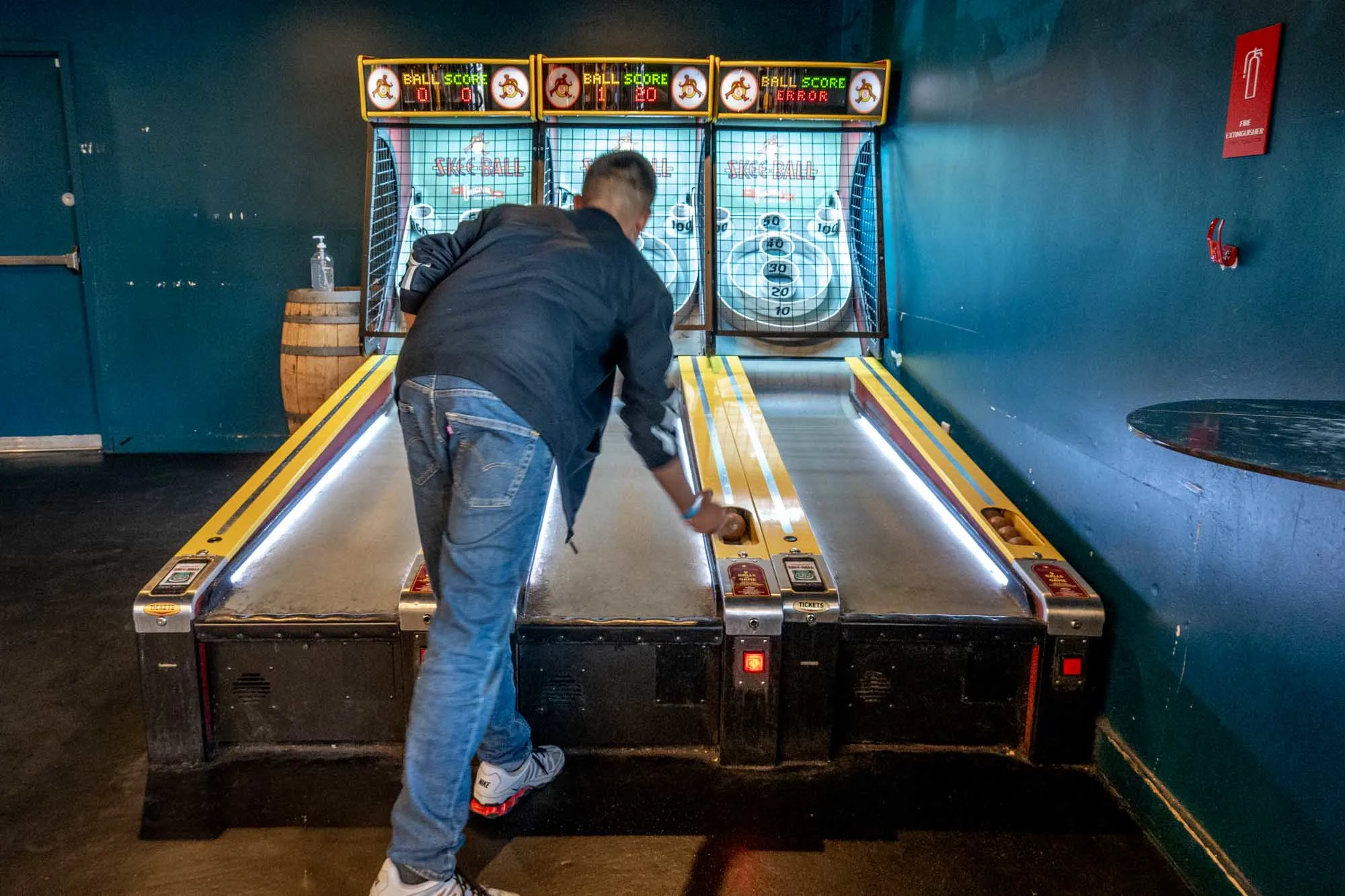 Man playing Skeeball