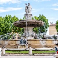 Large, two-level fountain with sculptures of lions and people in Aix-en-Provence