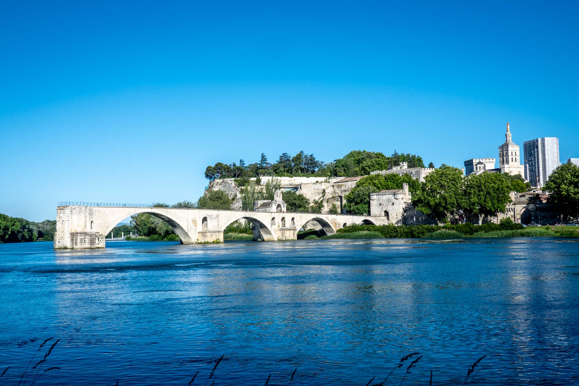 The ruins of the Pont d'Avignon stretch out into the river but do not reach the other bank