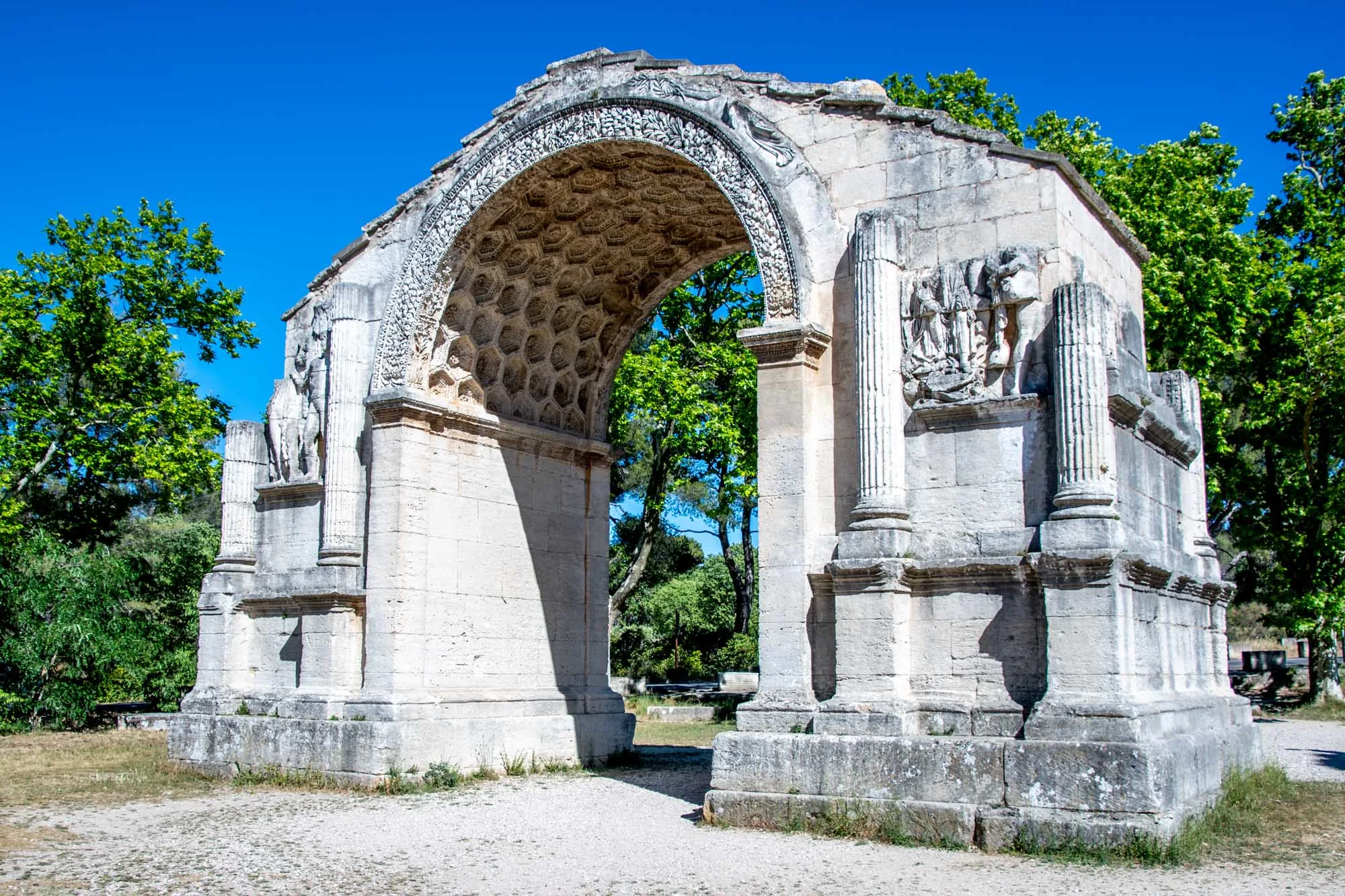 Large Roman stone arch with ornamental detail 
