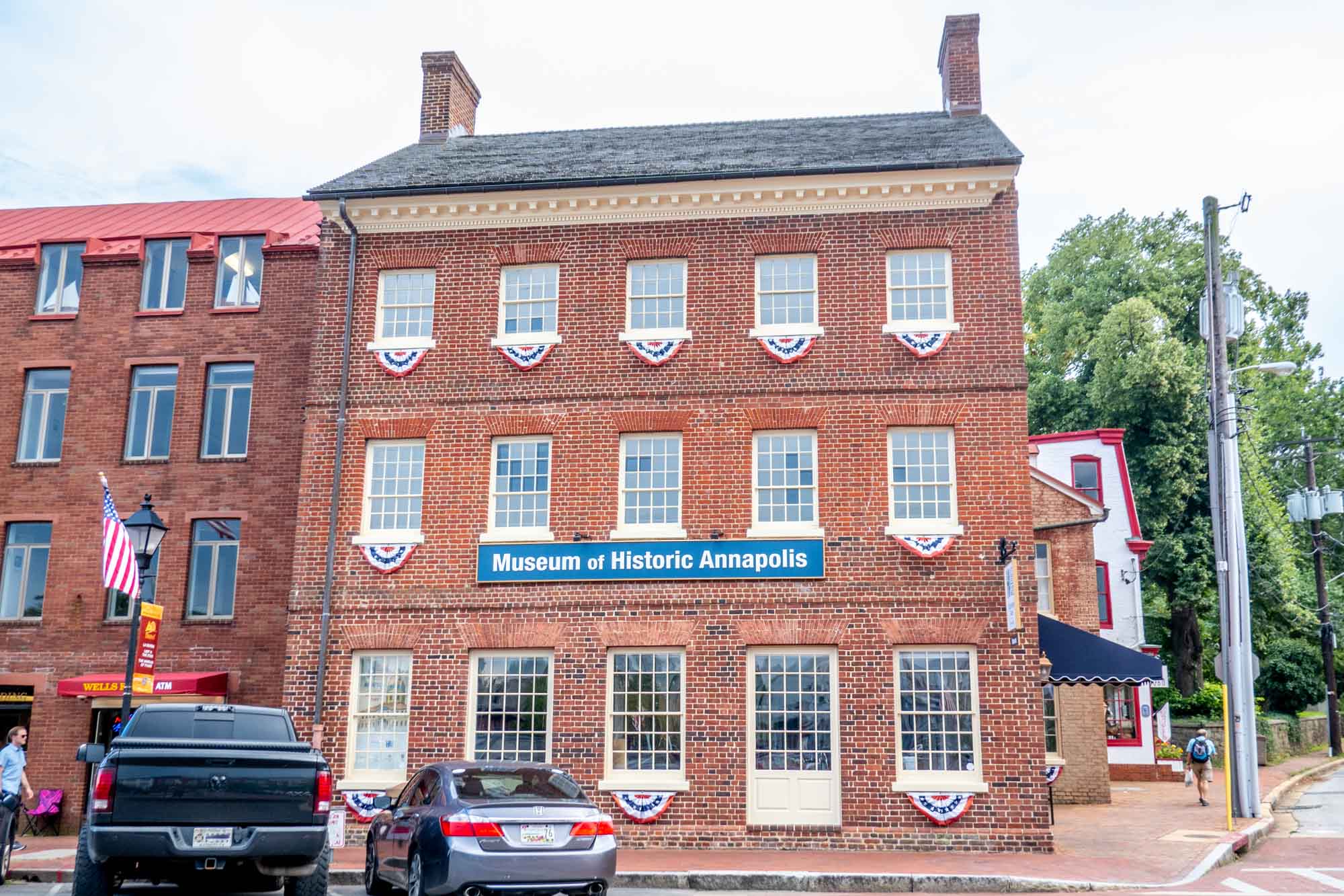 3-story brick building with rows of windows and a sign for "Museum of Historic Annapolis"