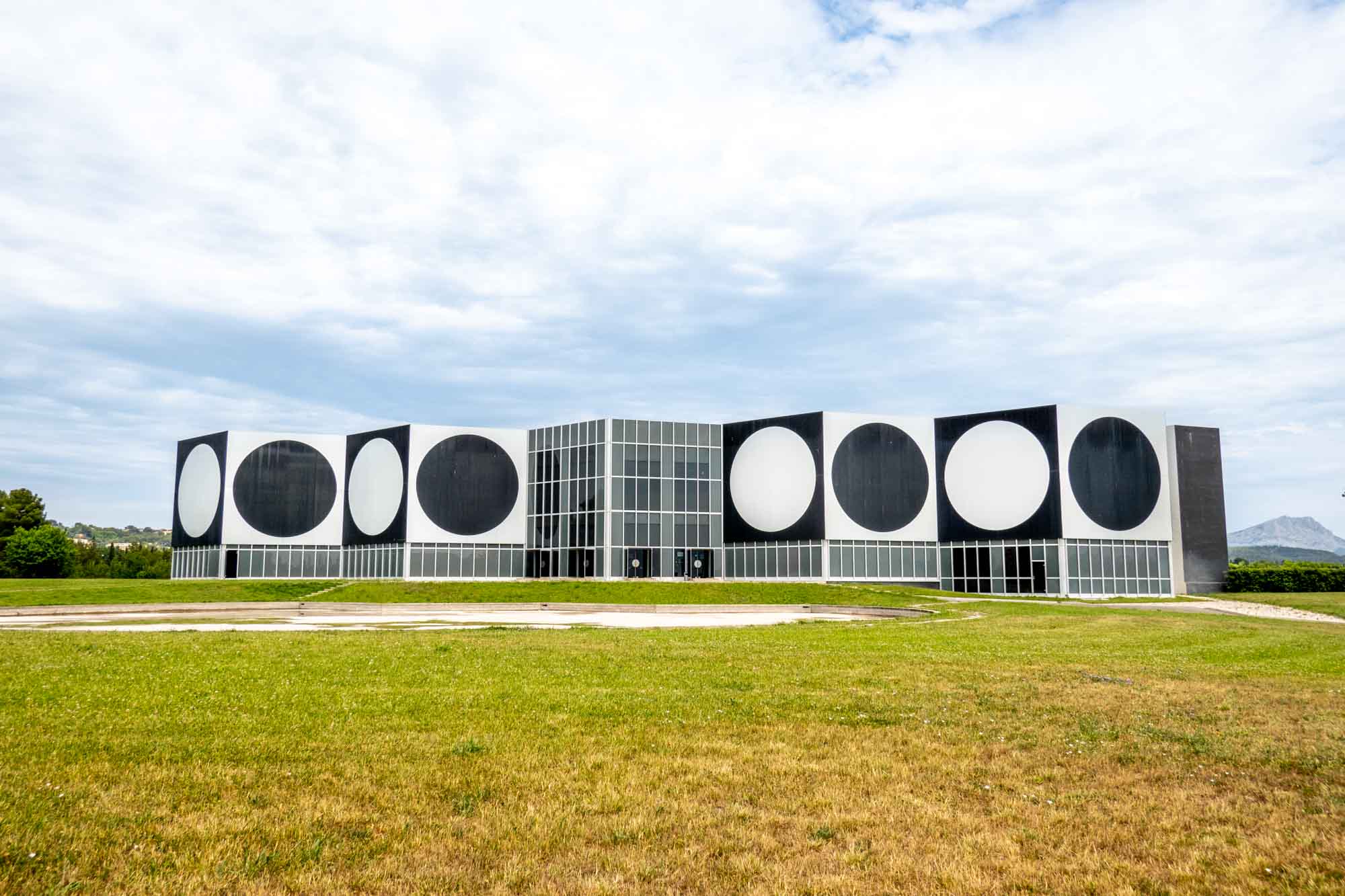Exterior of a building with a graphic design of black and white circles and squares.