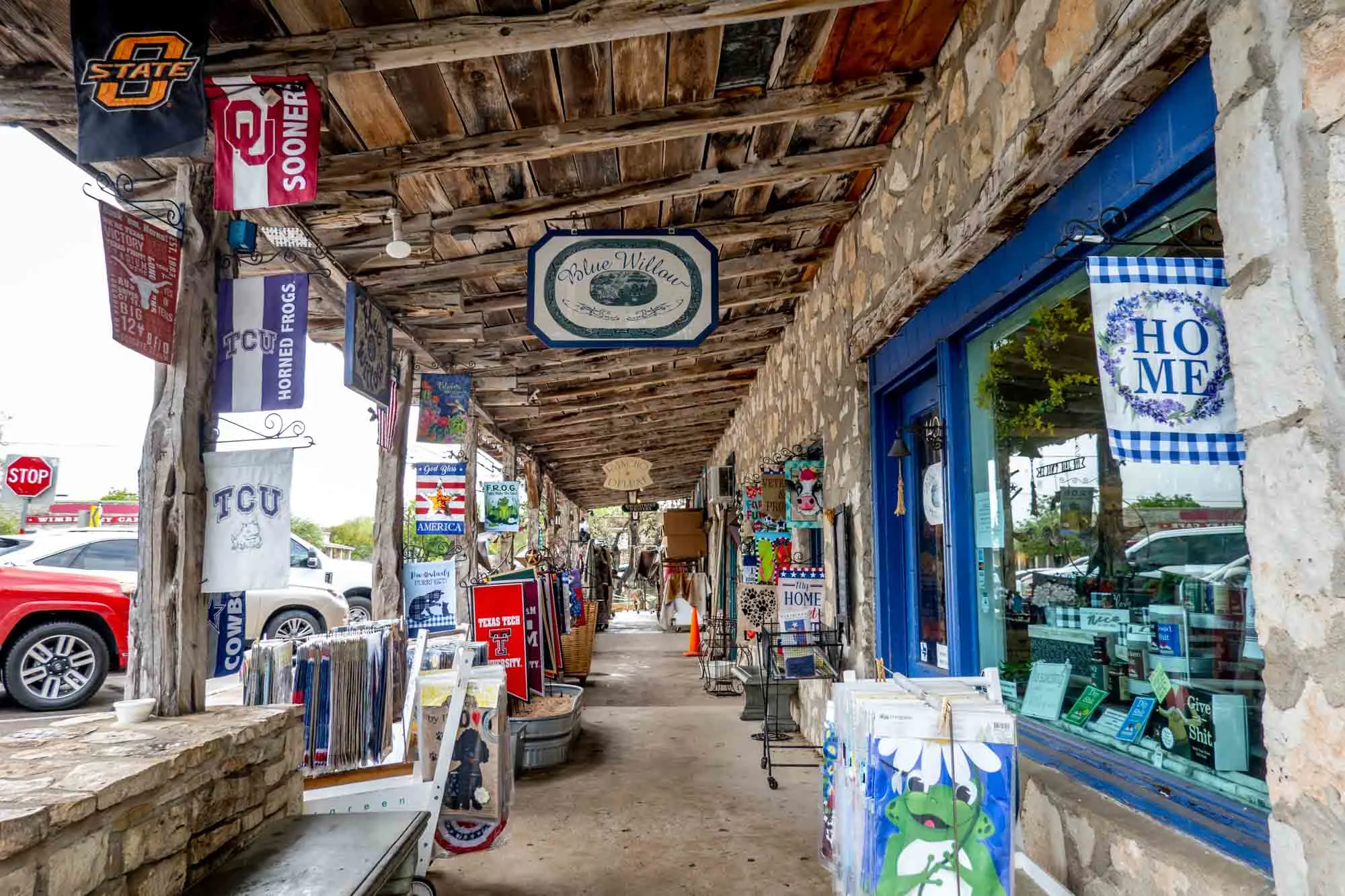Storefront decorated with flags on Wimberley Square.
