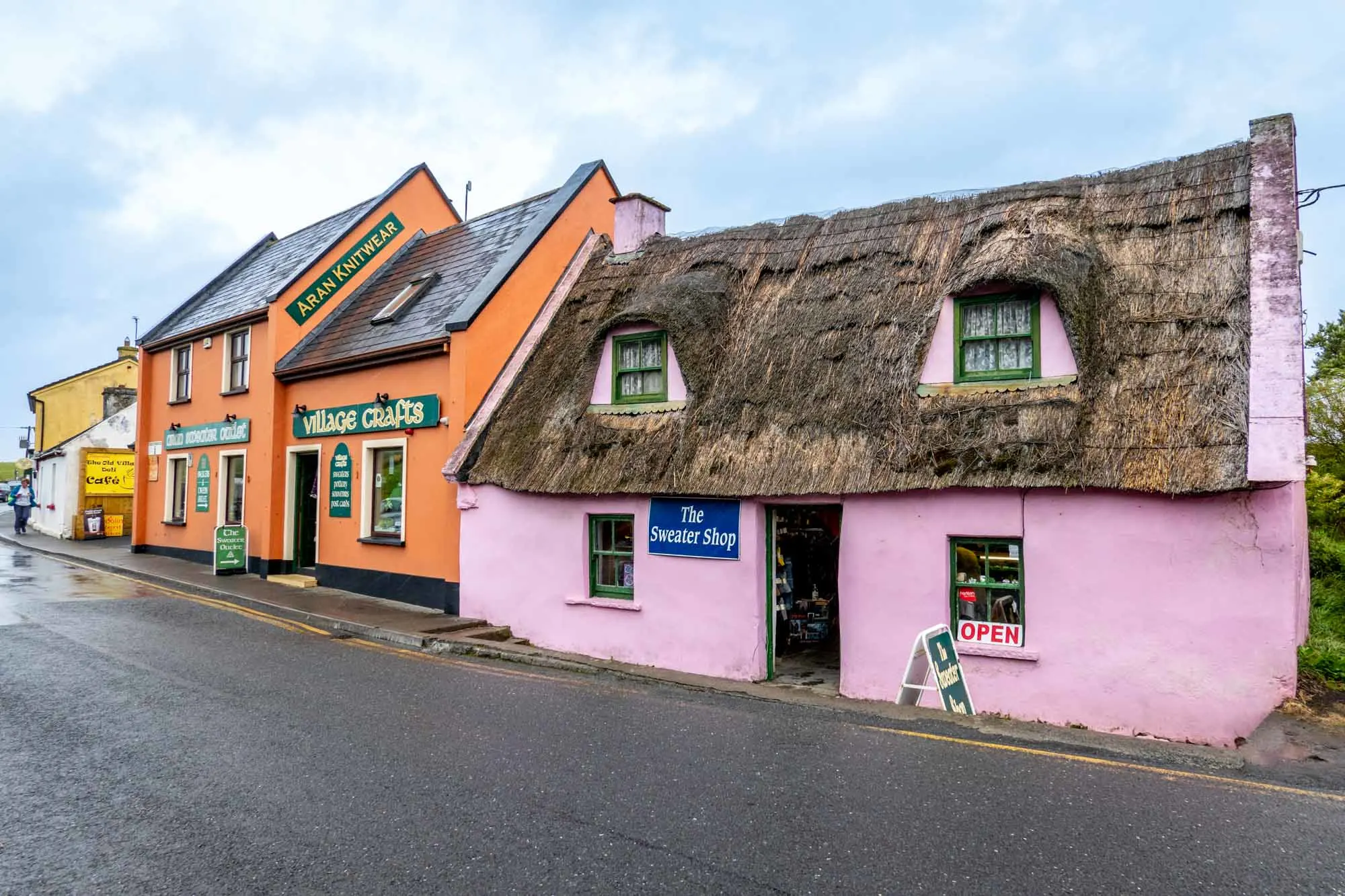 Two shops in Doolin, Ireland--one painted pink and one painted orange