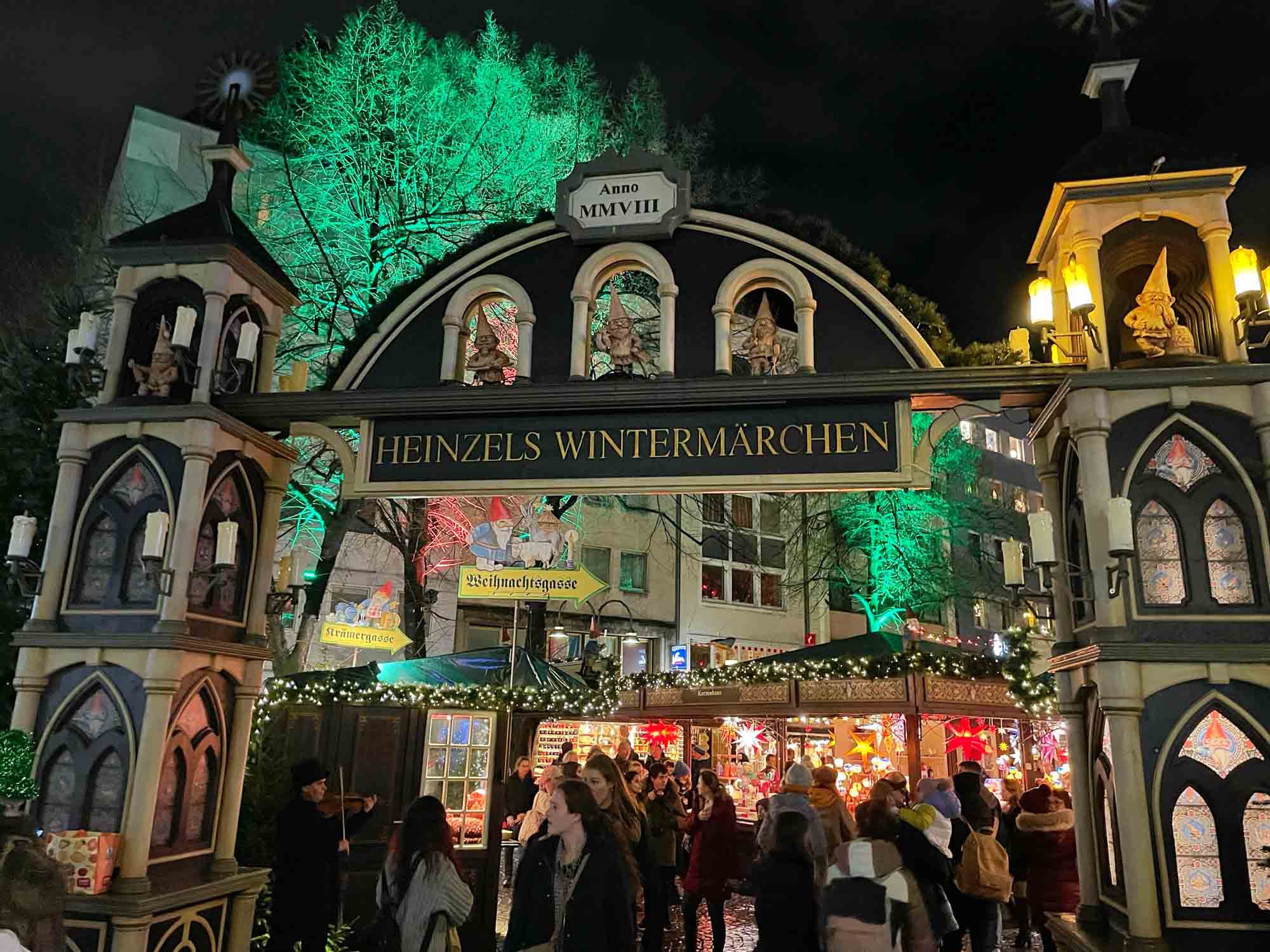 Entrance gate to a Christmas market in Cologne with a sign for "Heinzels Wintermarchen"