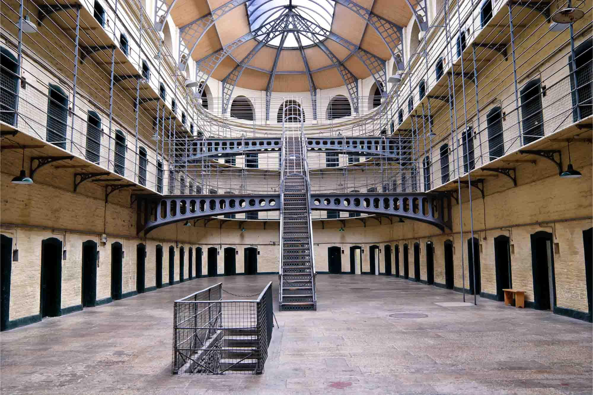 Several floors of jail cells surrounding a central courtyard