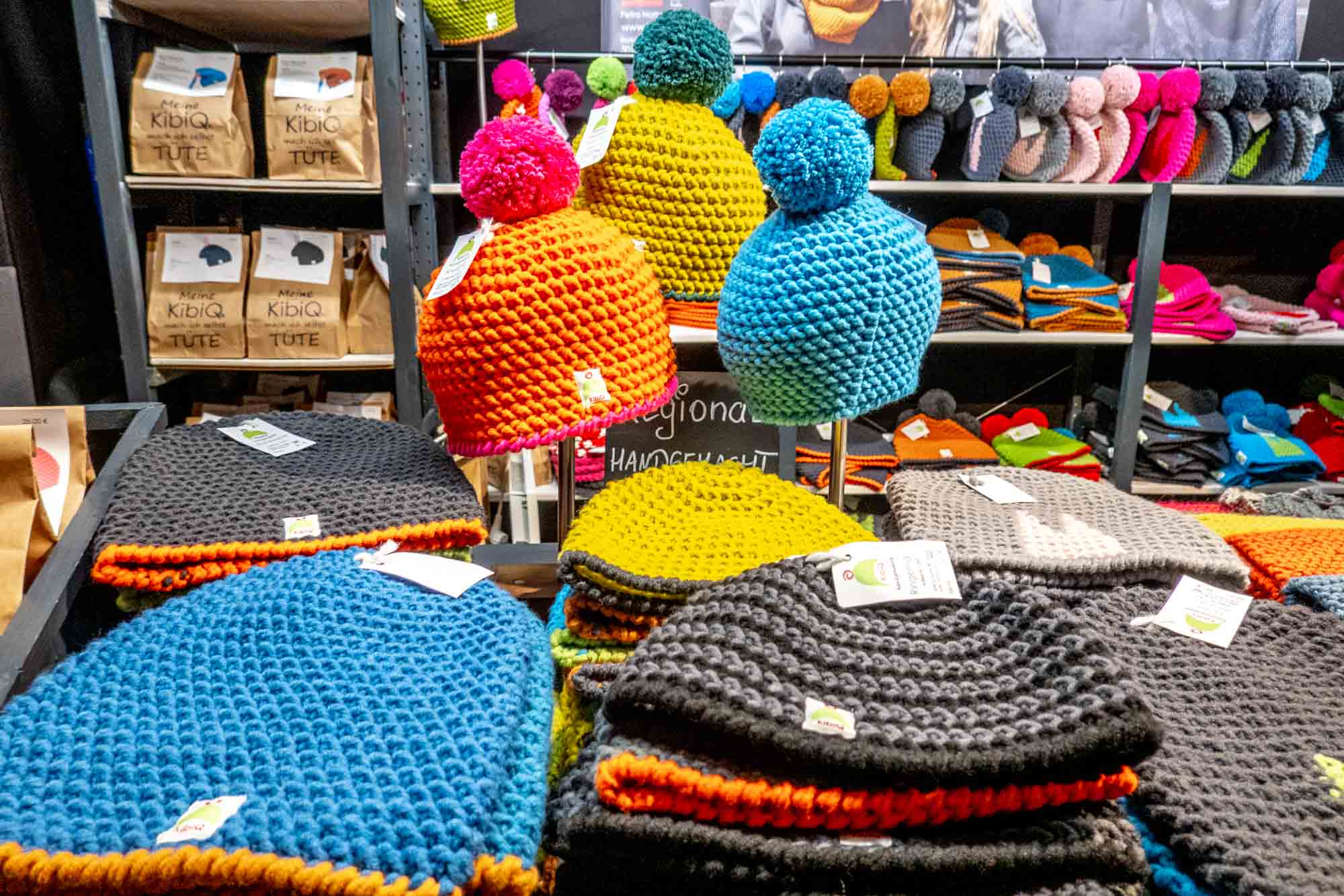 Knitted hats displayed for sale